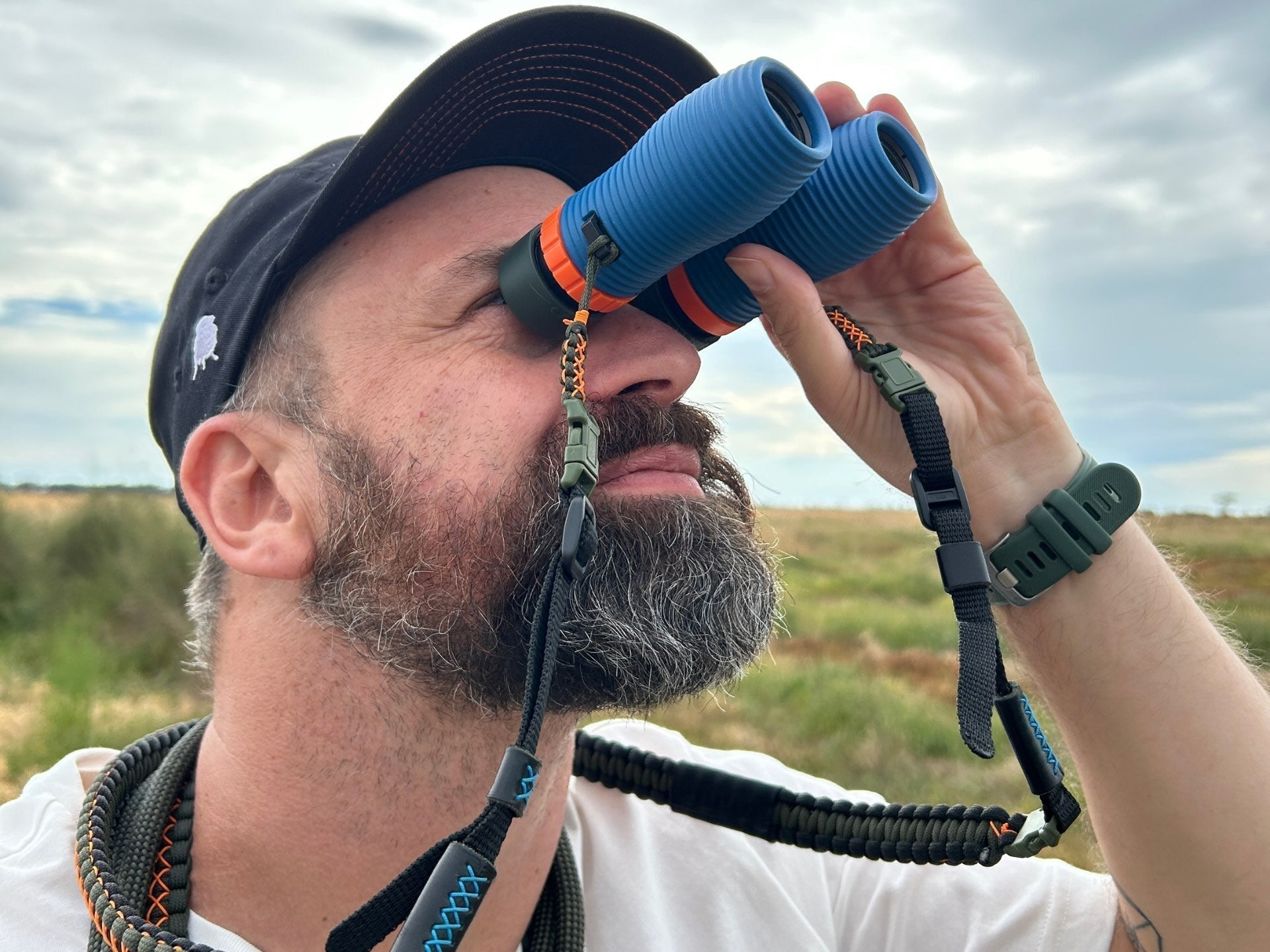 Bird-watcher using NOCS 8x25 binoculars out in the field