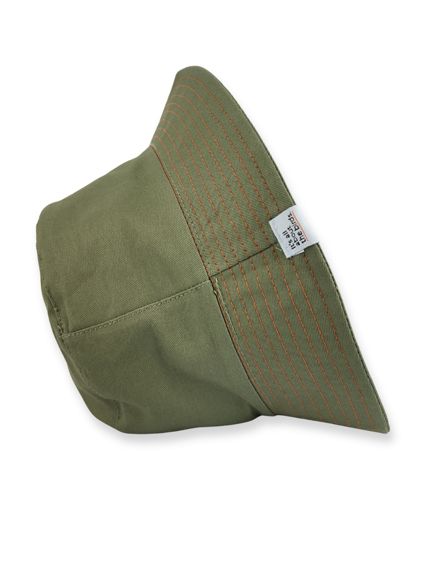Green fabric triangle with a label on a white background