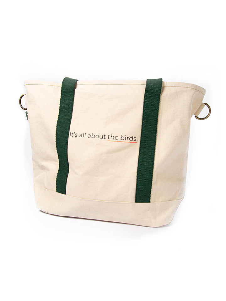 Full shot of Tote Bag showing the full design and proportions of the bag with Its All About The Birds tag line print on side.