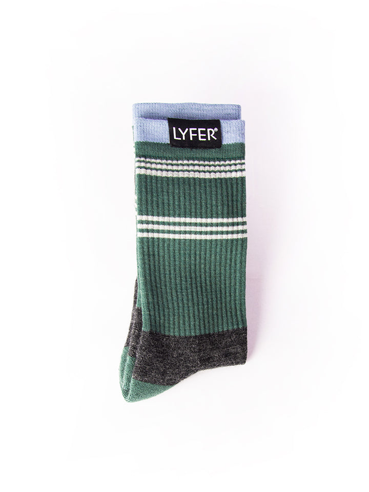 A pair of Lyfer Birdmark Field Socks in gray and green with a visible brand tag on the ankle.