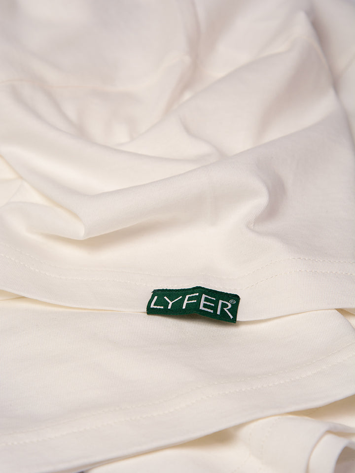 Zoomed-in image of the fabric woven tag that has the Lyfer brand logo in green