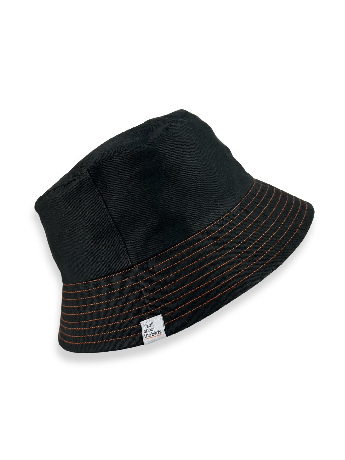 Black bucket hat with orange stitching on a white background