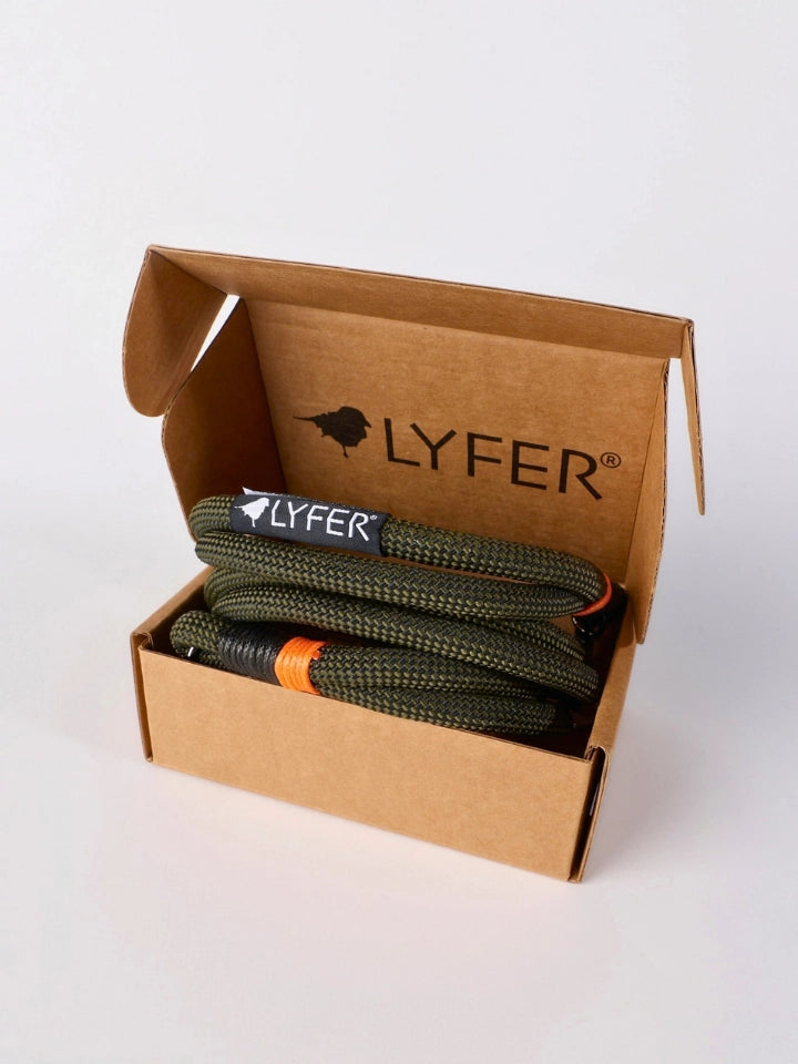A recycled box with LYFER printed, holding a green and orange Binocular strap