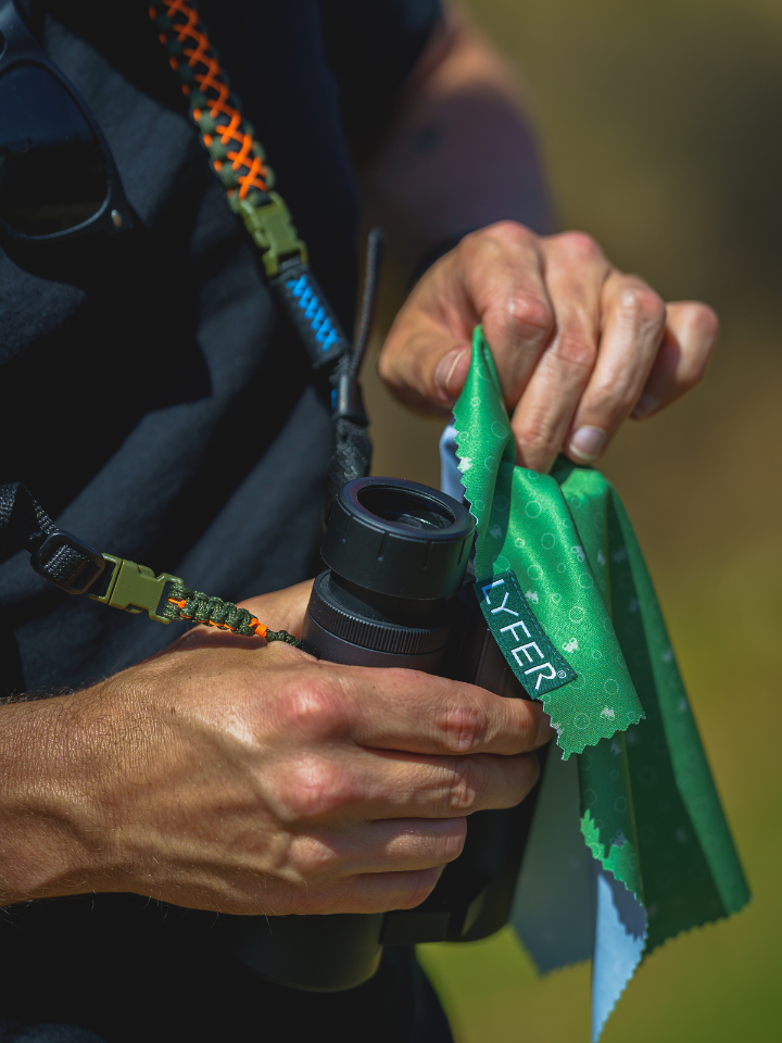 Close up detailing the Binocular micro-fibre cloth and the binocular straps for birders, an ideal birdwatching gift for Australian birders.