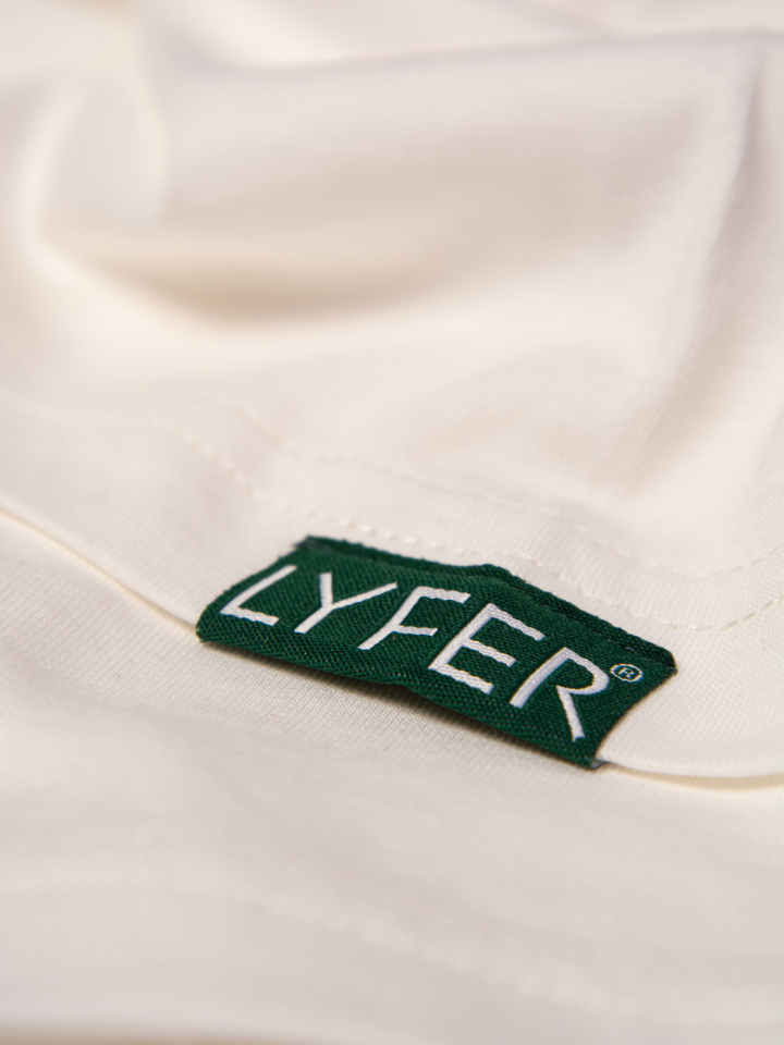 Close up showing the Lyfer woven tag on arm and the quality, for bird-lovers who want a bird print t-shirt gift that is quality birding gear.