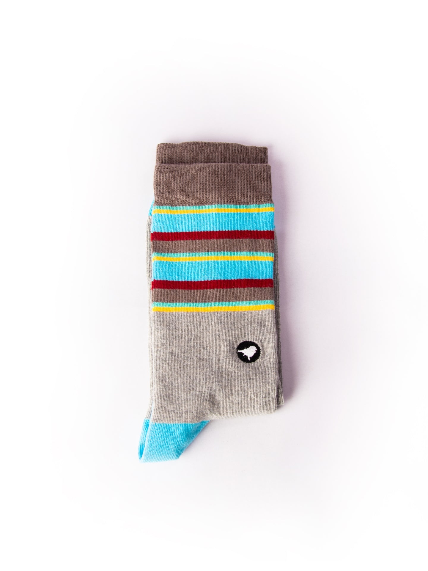 Lyfer Endangered Range socks of the Golden-shouldered Parrot colours and the birdmark embroidery on the sock ankle.