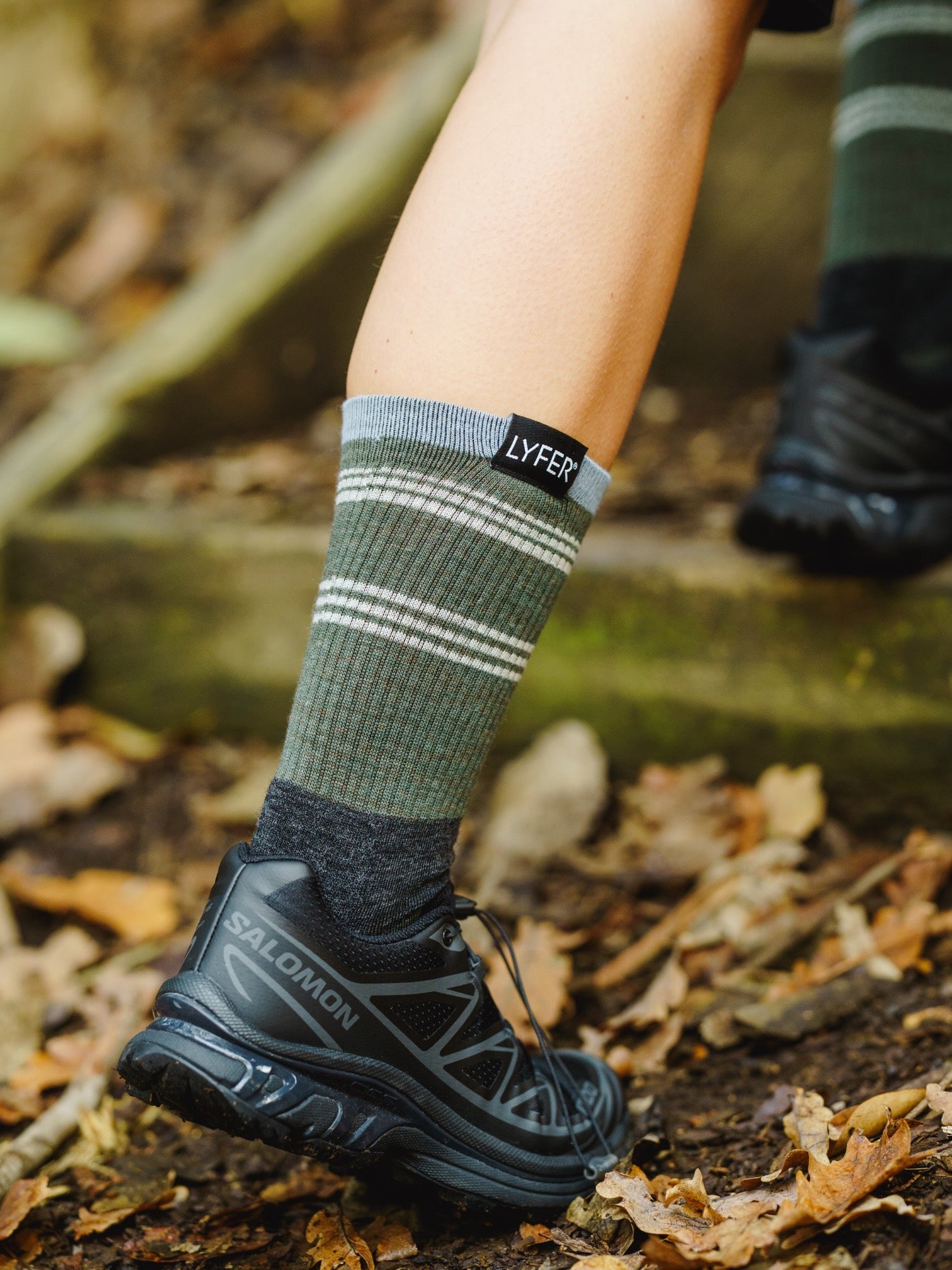 Close up of Lyfer Original socks, of a hiker outdoors on a bird walk.