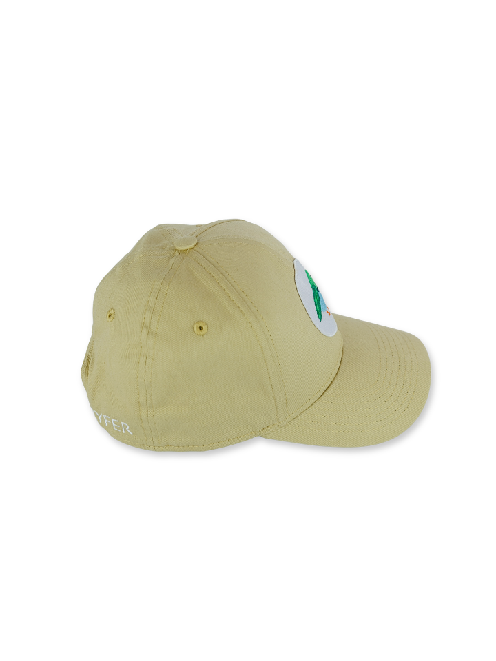 A light khaki baseball cap with a small white oval patch on the side featuring a bird patch, and partial white embroidered text on the side, shown against a plain white background.