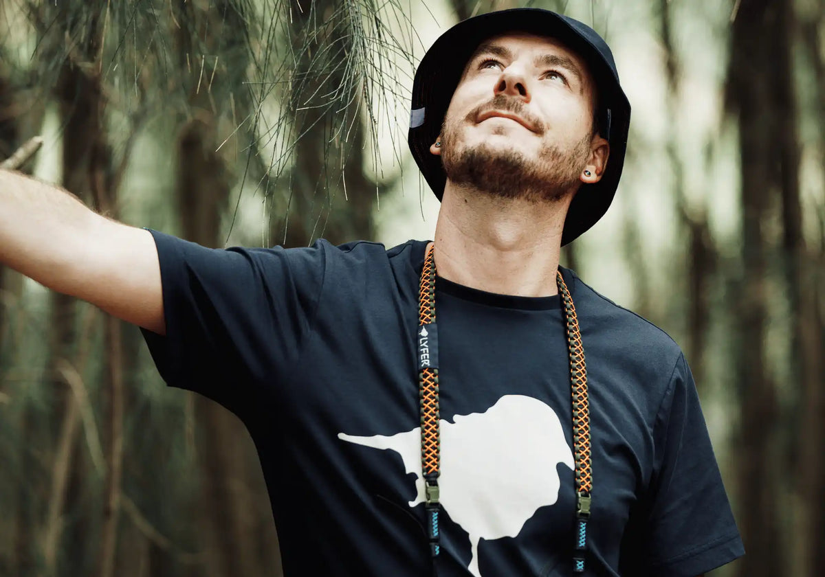 Lyfer BRAND tee with microcloth with binoculars being cleaned