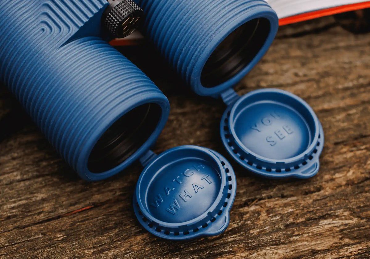 Image of person holding NOCS binoculars wth Lyfer adjustable strap