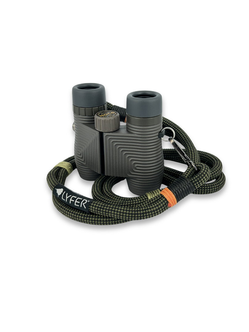 Binoculars with a carrying strap on a white background