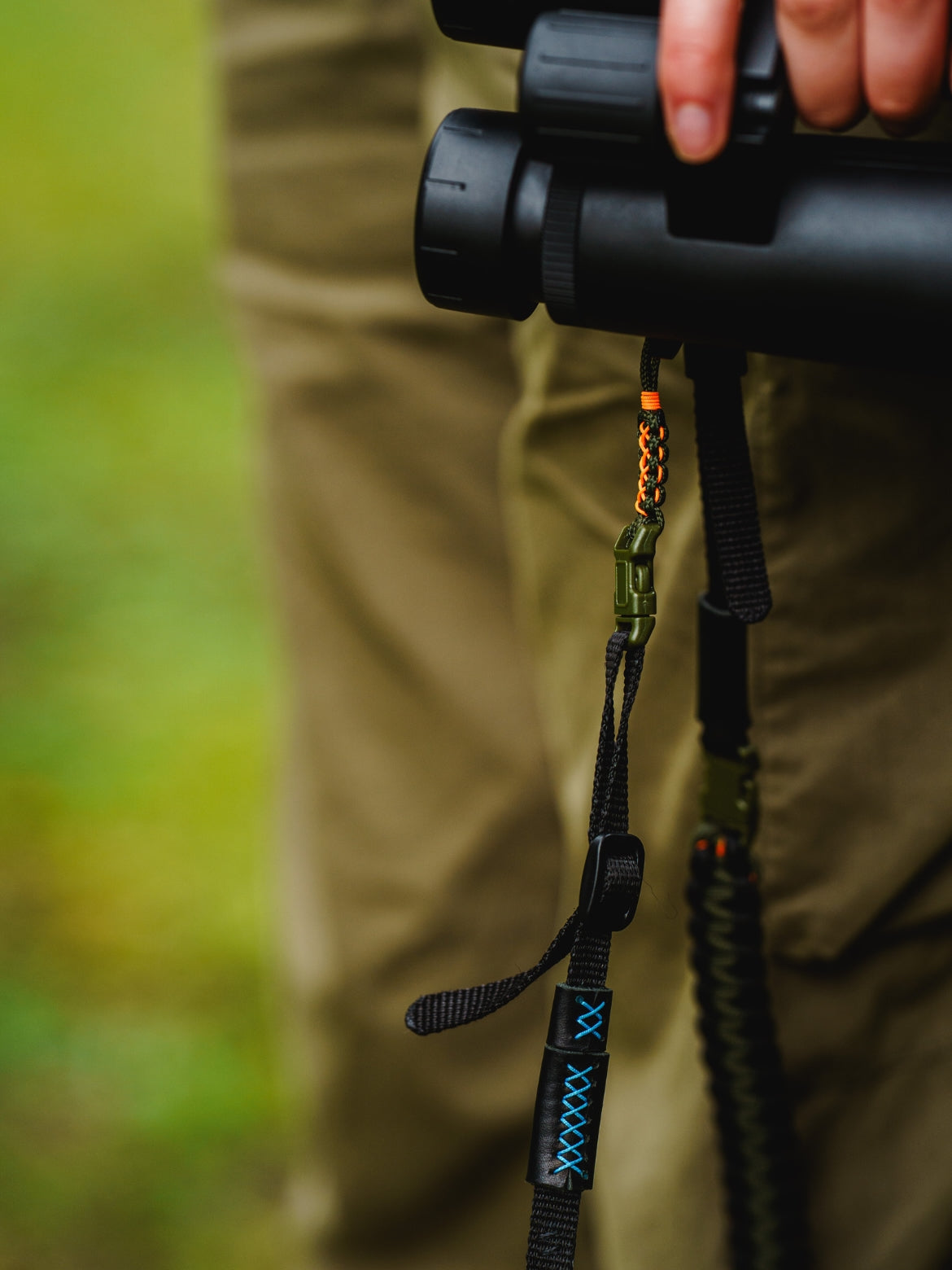 Adjustable Binocular and Camera Straps detailed shot of clasps and vegan leather hand detailing. 