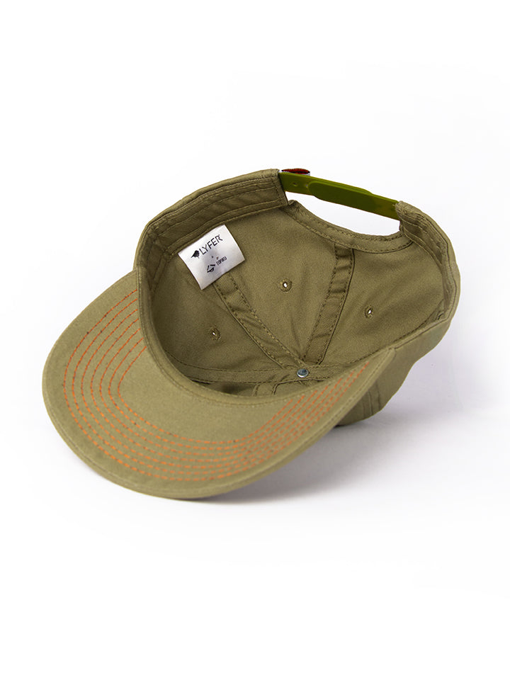 Inside of the Lyfer Birdmark 6-panel cap’s showing its detailed construction and the collaboration tag with Topiku. 