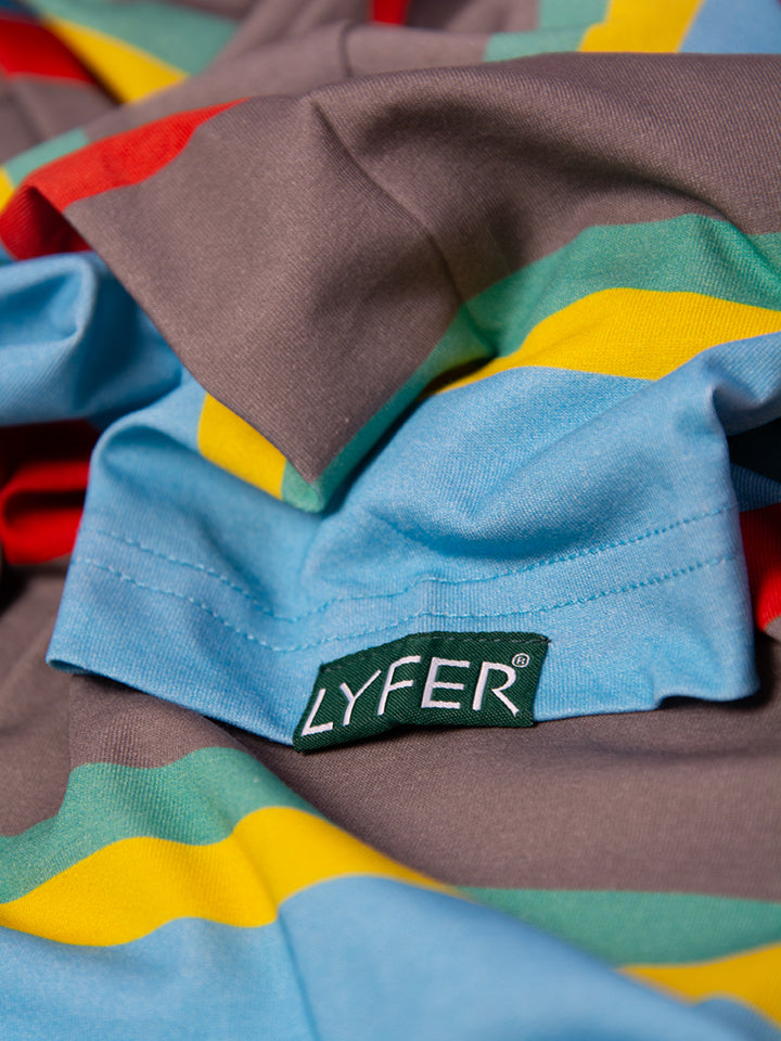 Detail shot of the bird-inspired stripes on the t-shirt’s sleeve and the lyfer woven tag detailing.
