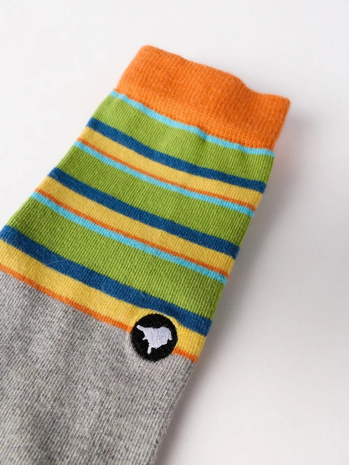Close up of a multi-coloured socks showing a LYFER logo embroidery