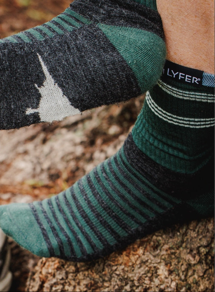 LYFER Birdmark Field socks with a brand label on a natural background