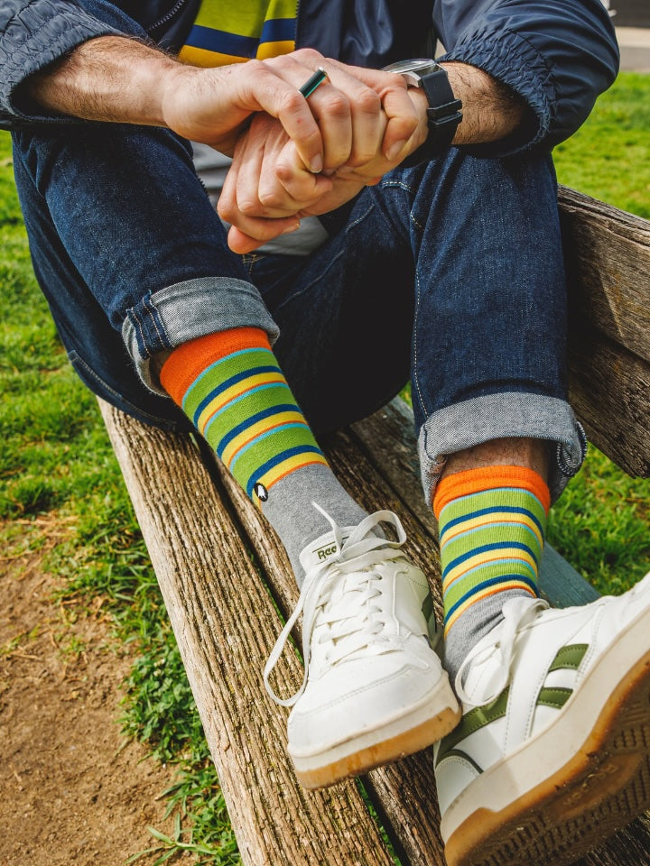 Model wearing a pair of OBP coloured socks with a pair of white trainers