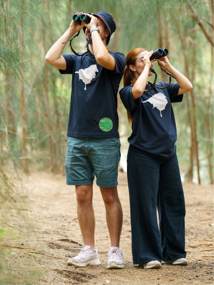 Two Models outdoor with binoculars wearing Lyfer birdmark t-shirts. 