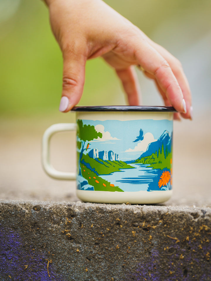 Lyfer Enamel Field Mug outdoors with model hand