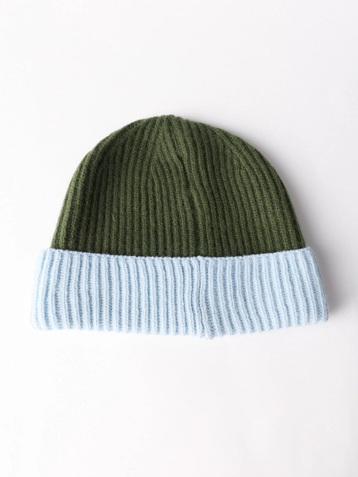A ribbed knit beanie hat with an olive green top section and a light blue folded cuff, shown from the back