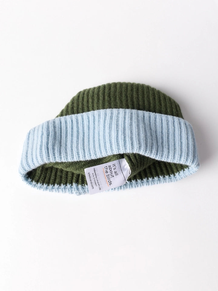 LYFER knitted beanie showing the internal care tag that says Its all about the birds